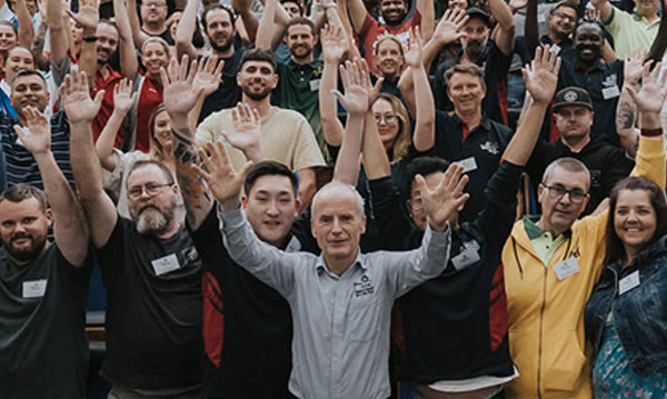Large group of new franchisees with Jim Penman