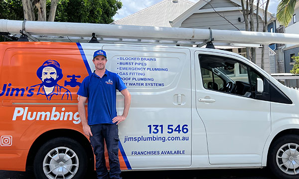 Rhys standing in front of Jim's van