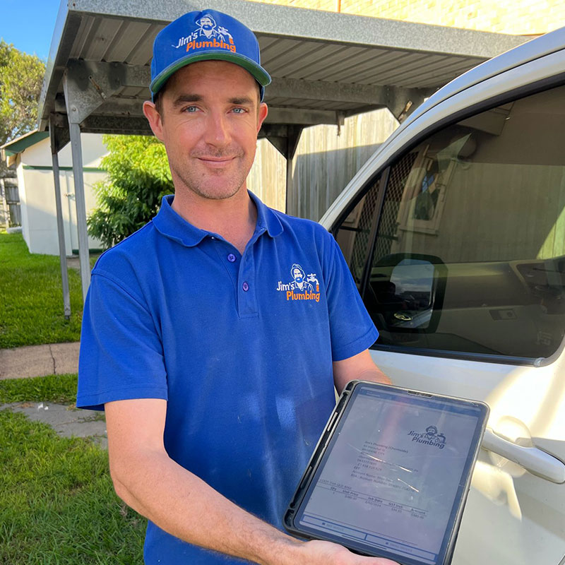 Plumber showing customer invoice on iPad