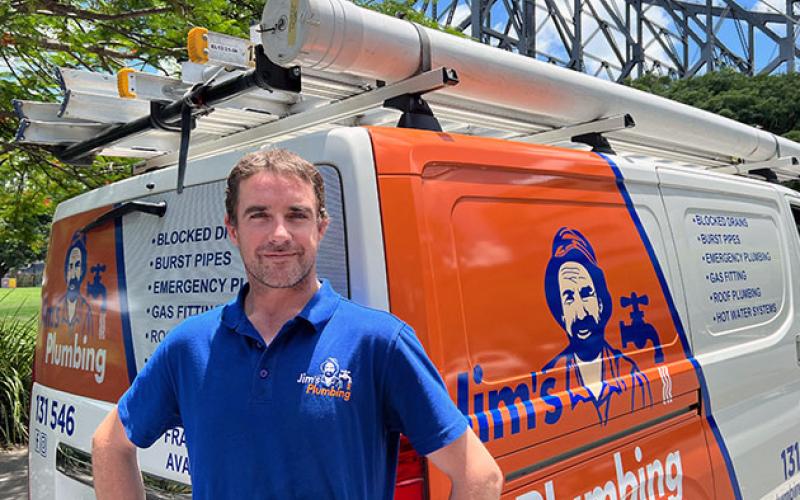 Rhys from Jim's Plumbing Chermside in front of Story Bridge