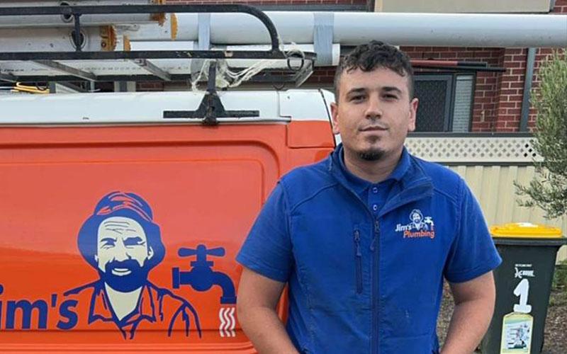 Serkan from Jim's Coburg in front of van
